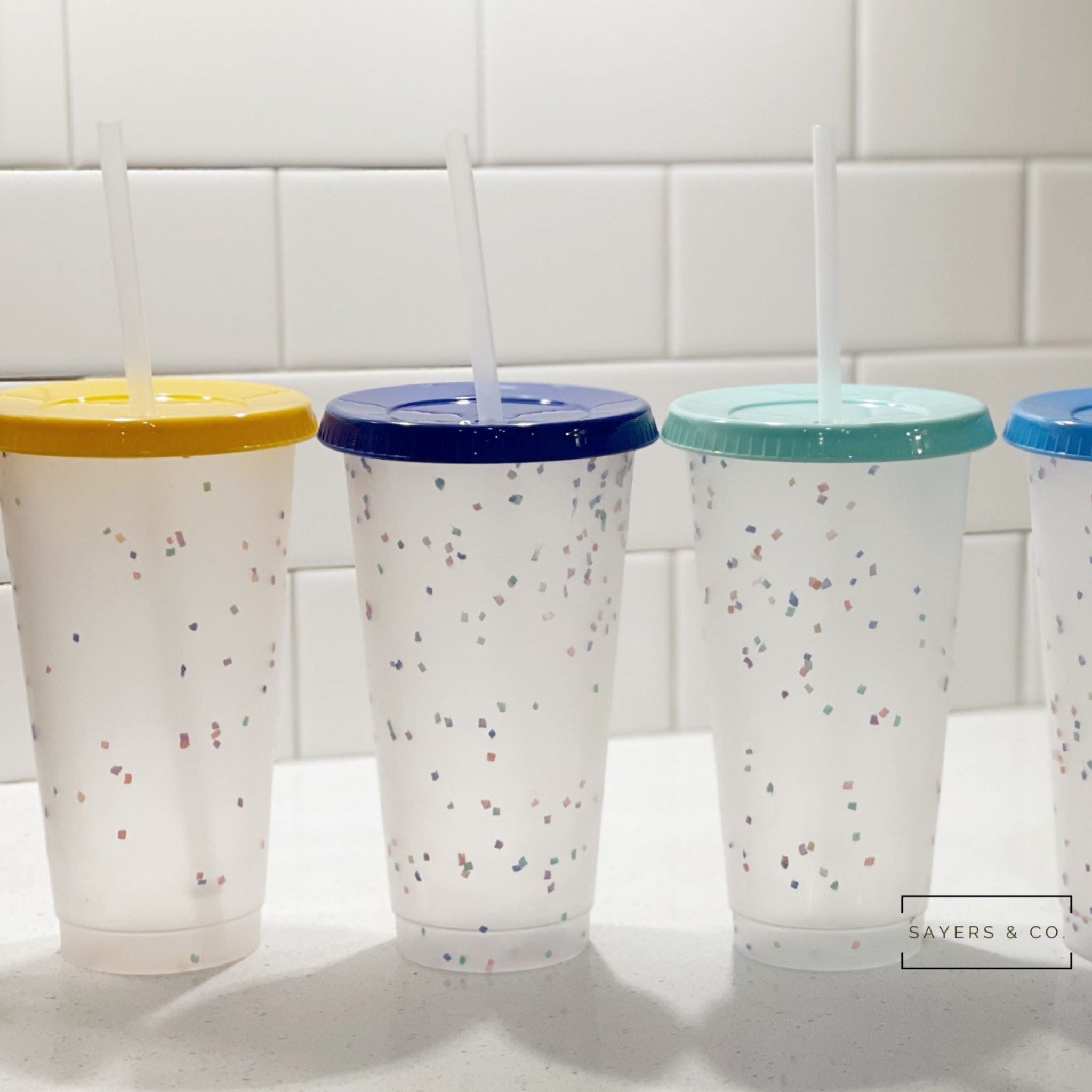 https://www.sayersandco.com/cdn/shop/products/24oz-Color-Changing-Confetti-Cold-Cups-Clear.jpg?v=1691280731